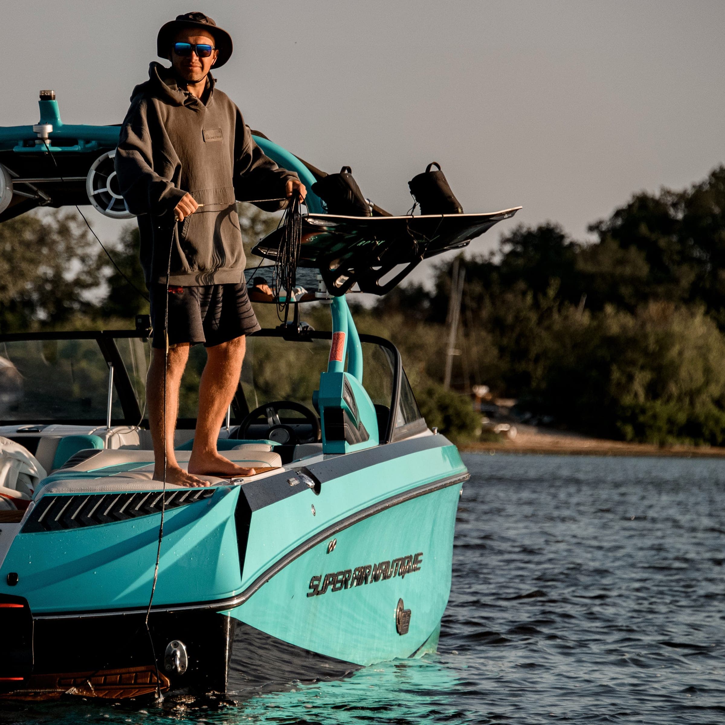 Roberts on the back of the boat, ready to coach