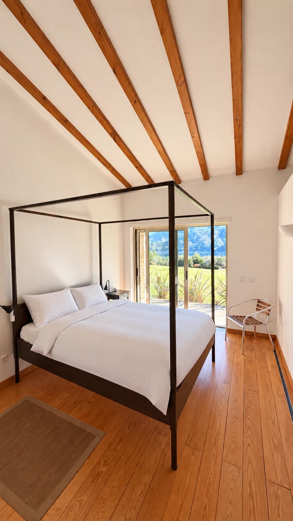 Double room with a four-poster bed and doors to the garden